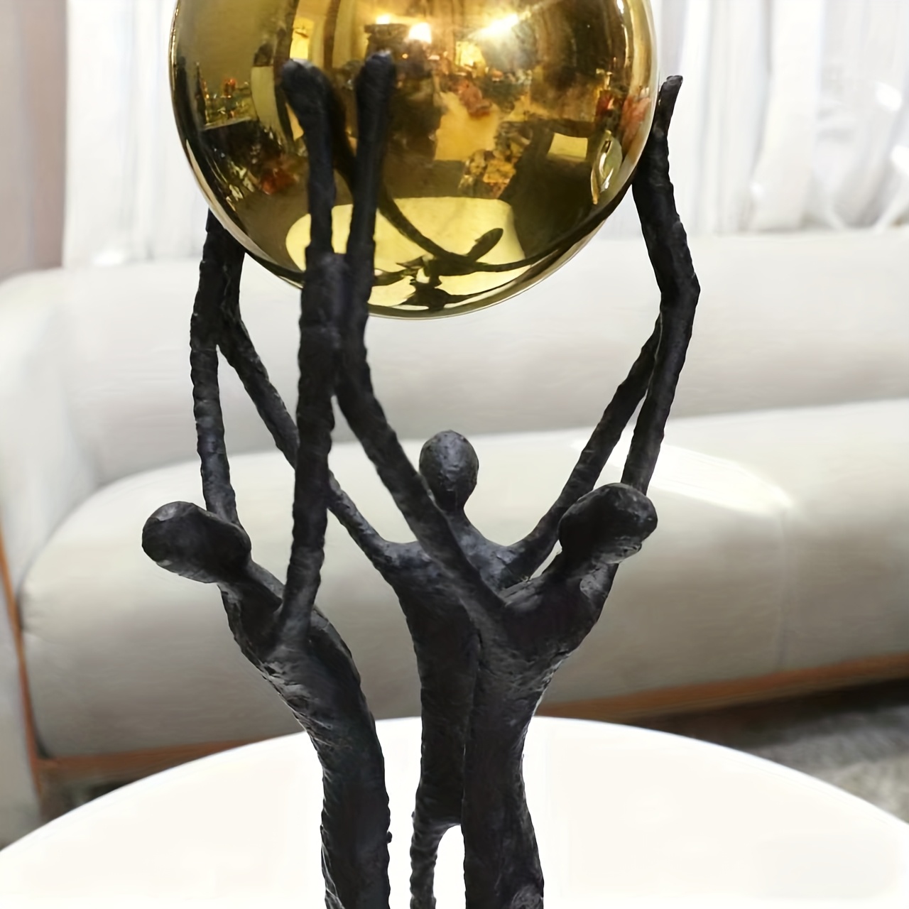 Modern Minimalist Metal Cast Iron Three-Person Lifting Ball Sculpture