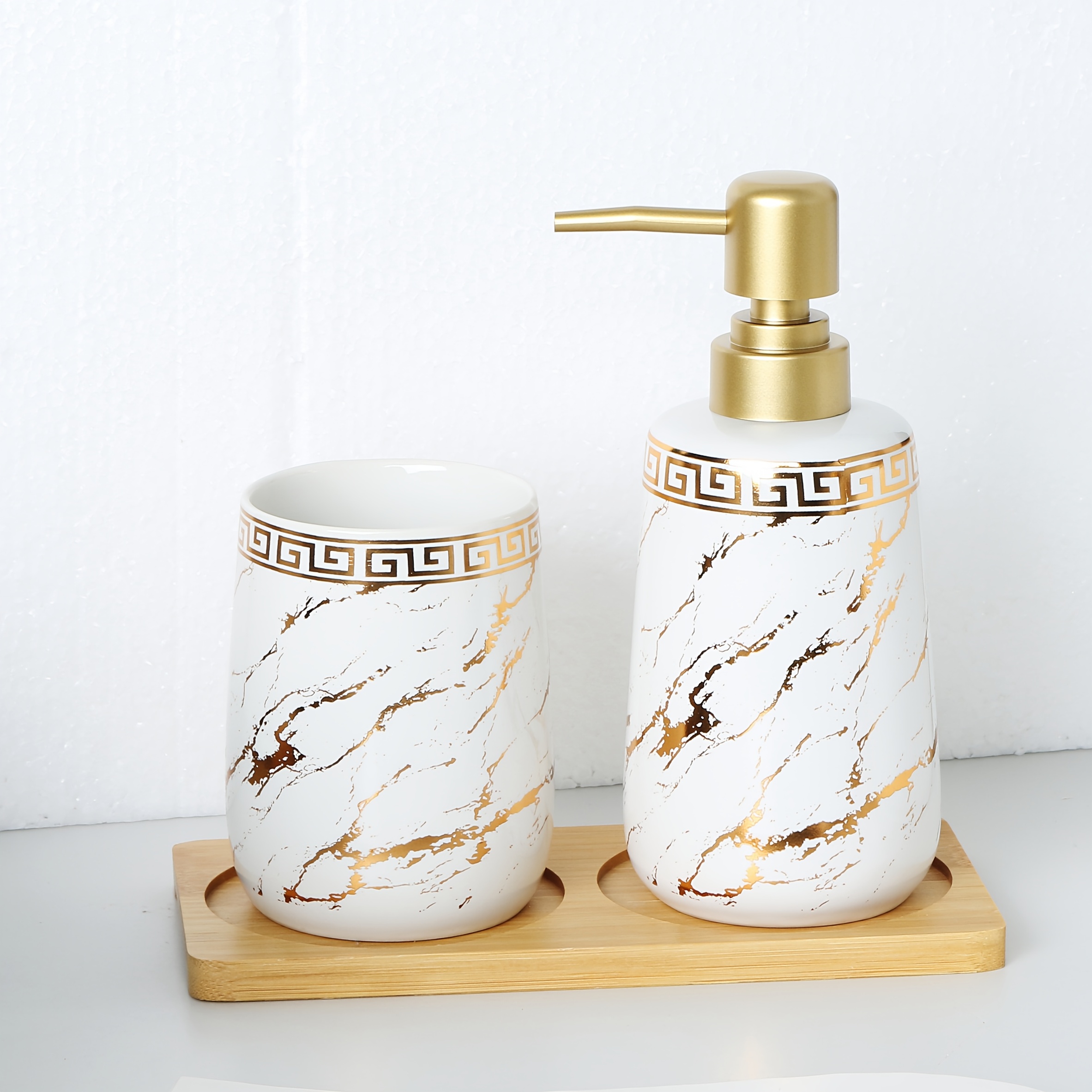 Set of Three Ceramic Bathroom Additions Featuring a Golden Pattern